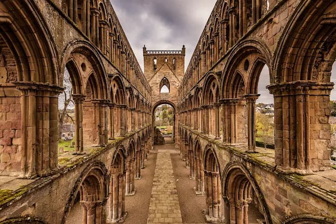 Looking down the roofless nave of Jedburgh Abbey toward the central tower